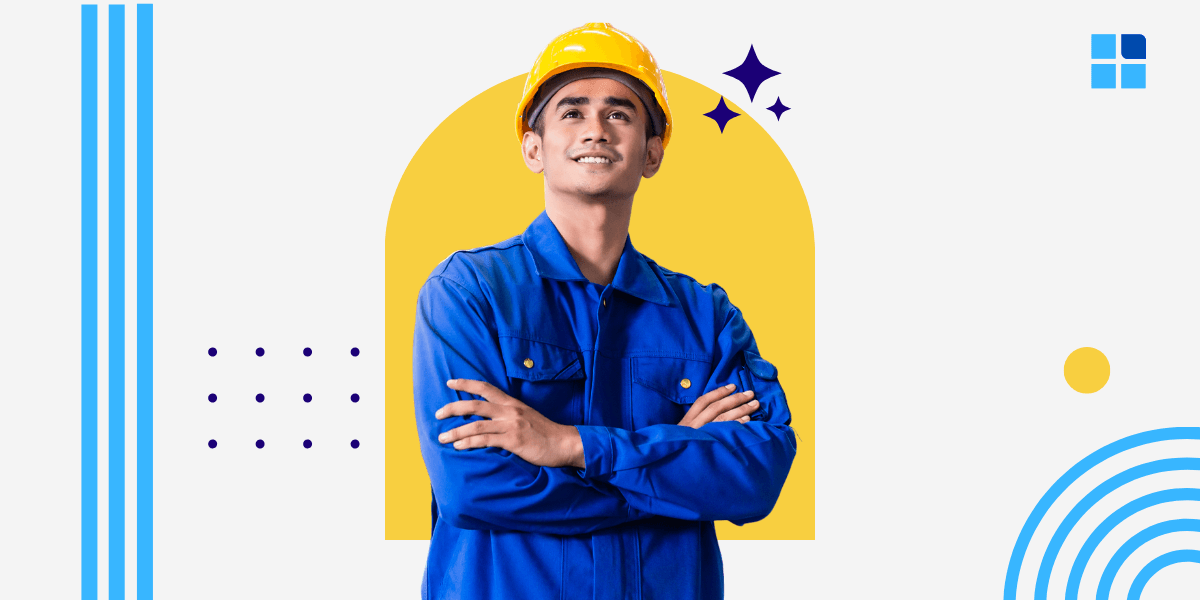 Young person in blue work attire and yellow hard hat, arms crossed confidently.