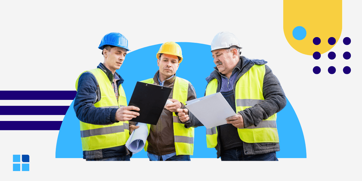 Three construction workers in hard hats and safety vests review documents on clipboards.