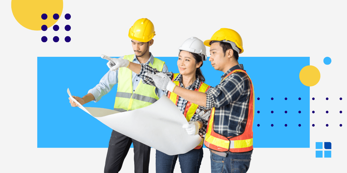 Three construction workers in hard hats and safety vests examine blueprints.