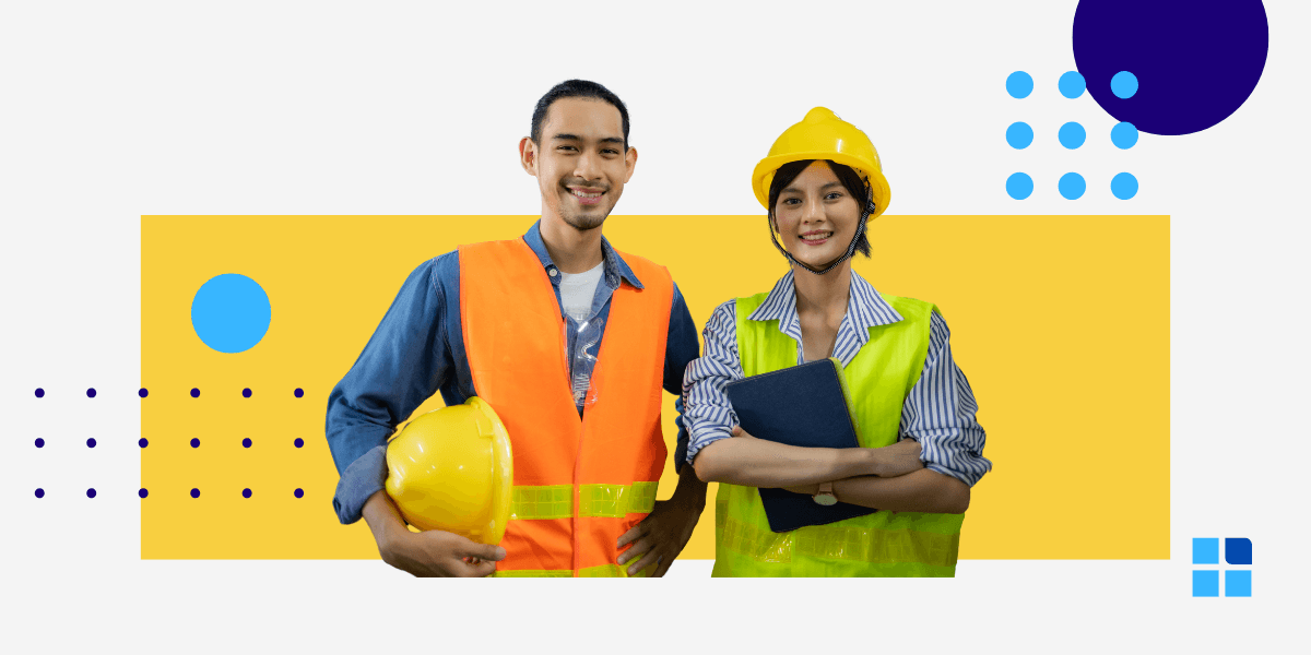 2 smiling construction workers, a man & a woman, wearing orange and yellow safety vests & hard hats.