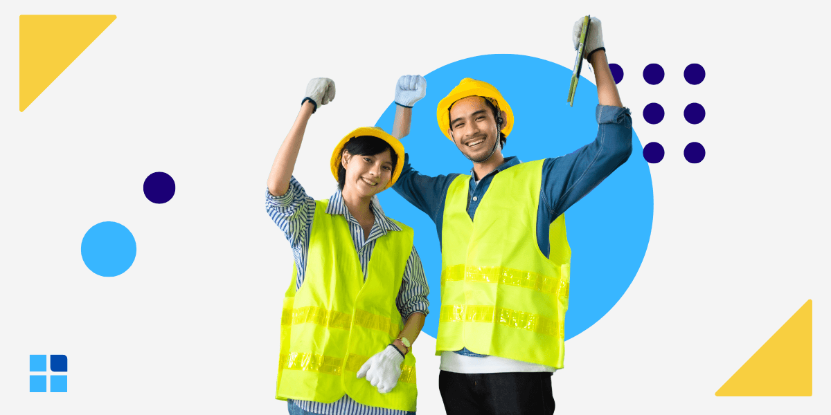 Two construction workers in yellow vests and hard hats celebrate with raised fists.