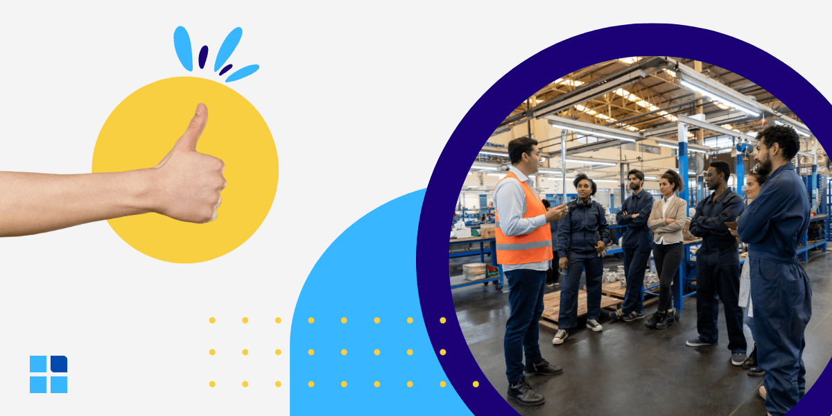 A worker in a safety vest speaks to colleagues in a factory setting, conveying teamwork.